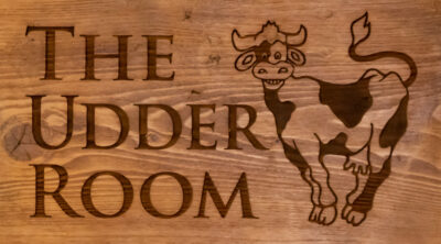 The Udder Room Sign